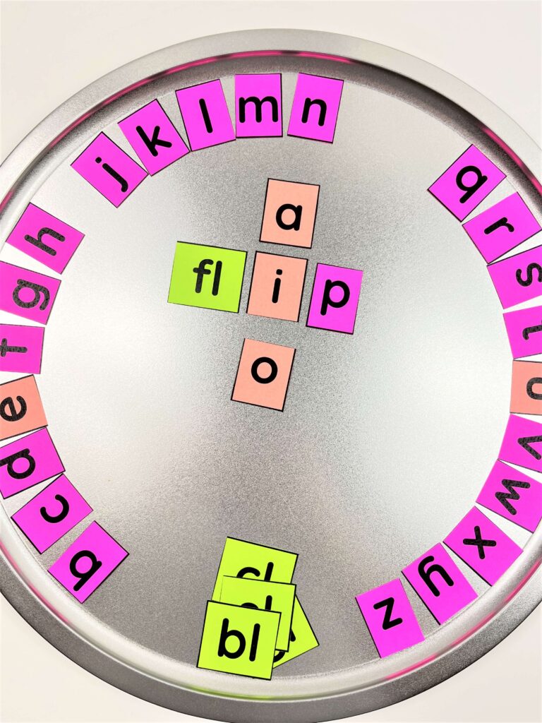 Pizza pan with DIY magnetic letter tile phonics manipulatives for sound substitution.