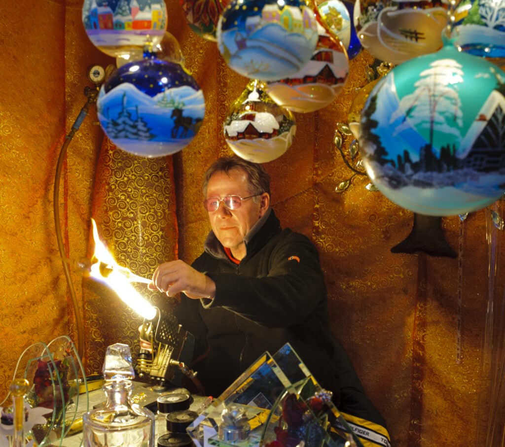 German glass blower making Christmas ornaments