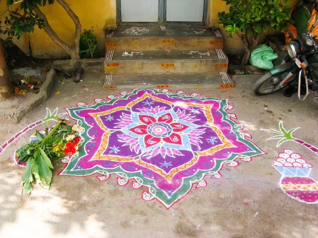 Colorful design painted around the front door called Rangoli in India for Diwali