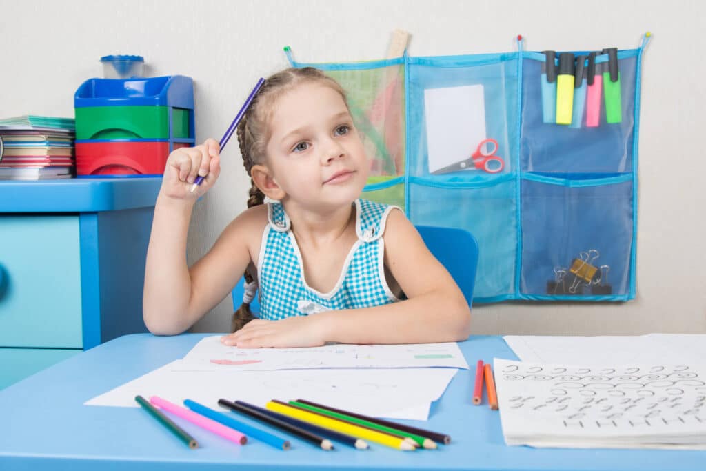 Little girl in a calm down corner in a first grade classroom.